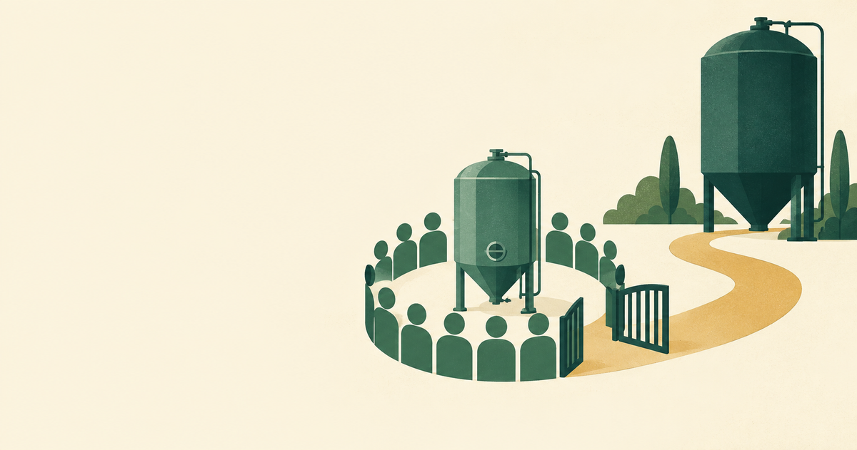 Employee ownership circle around a brewery tank with an open gate to a larger owner